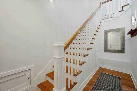 a view of an entryway with wooden floor