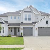 front view of a house and a yard