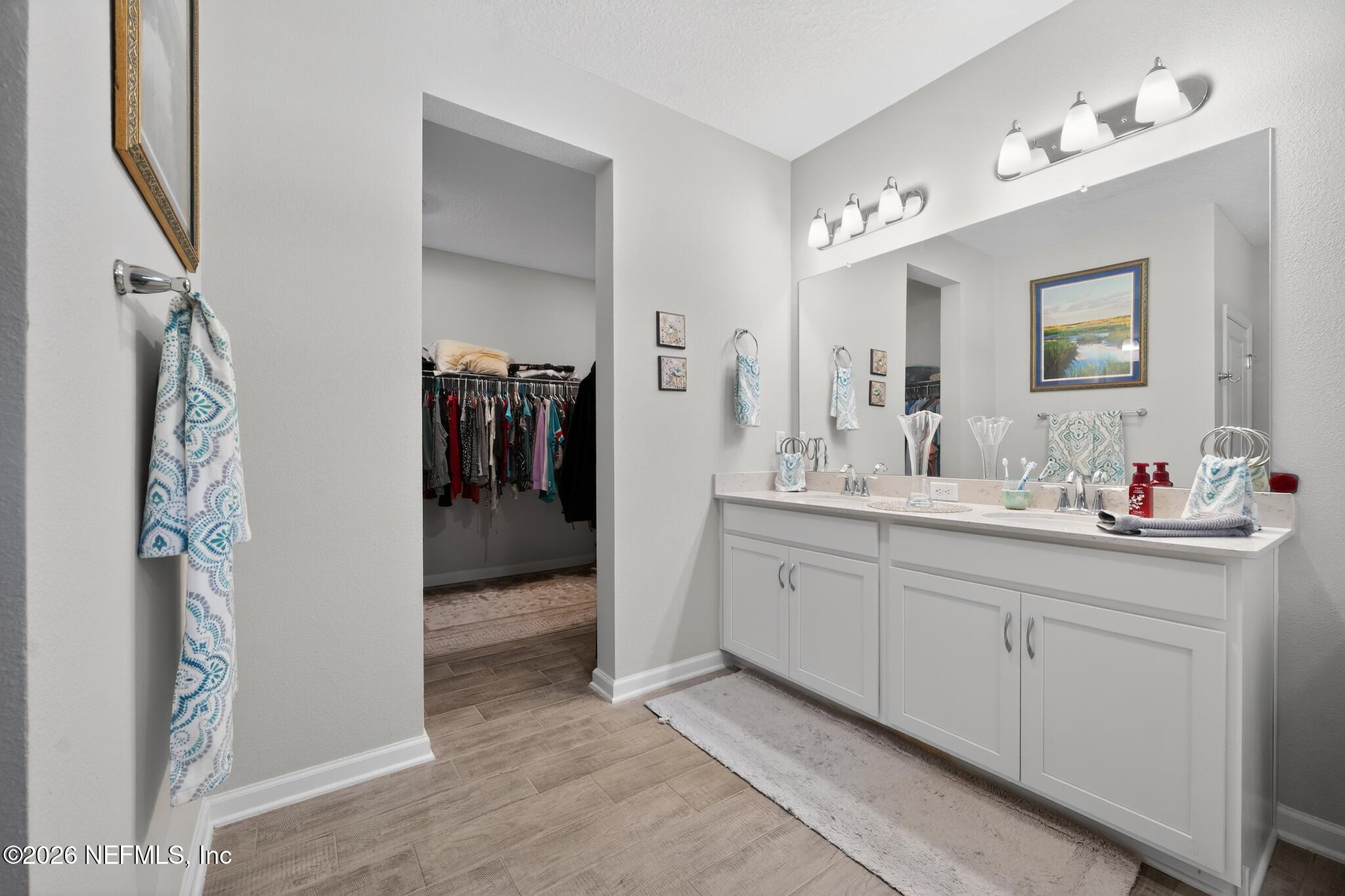75505 Banyan Way Yulee, FL 32097 - Photo 23 of 30 a bathroom with a double vanity sink and a mirror
