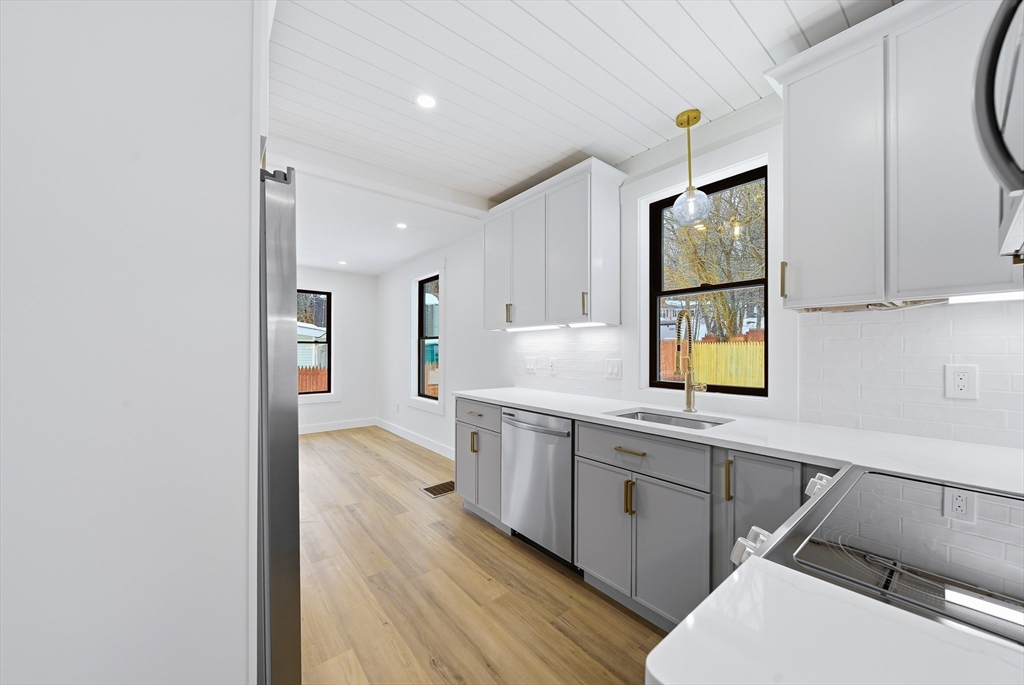 26 Rivulet Street Uxbridge, MA 01569 - Photo 12 of 41 a kitchen with a sink appliances and cabinets