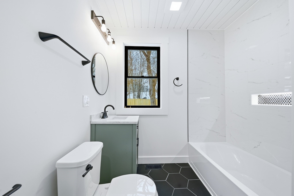 26 Rivulet Street Uxbridge, MA 01569 - Photo 17 of 41 a bathroom with a toilet sink and shower