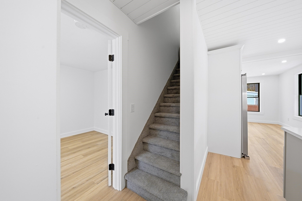 26 Rivulet Street Uxbridge, MA 01569 - Photo 20 of 41 a view of entryway and hall with wooden floor