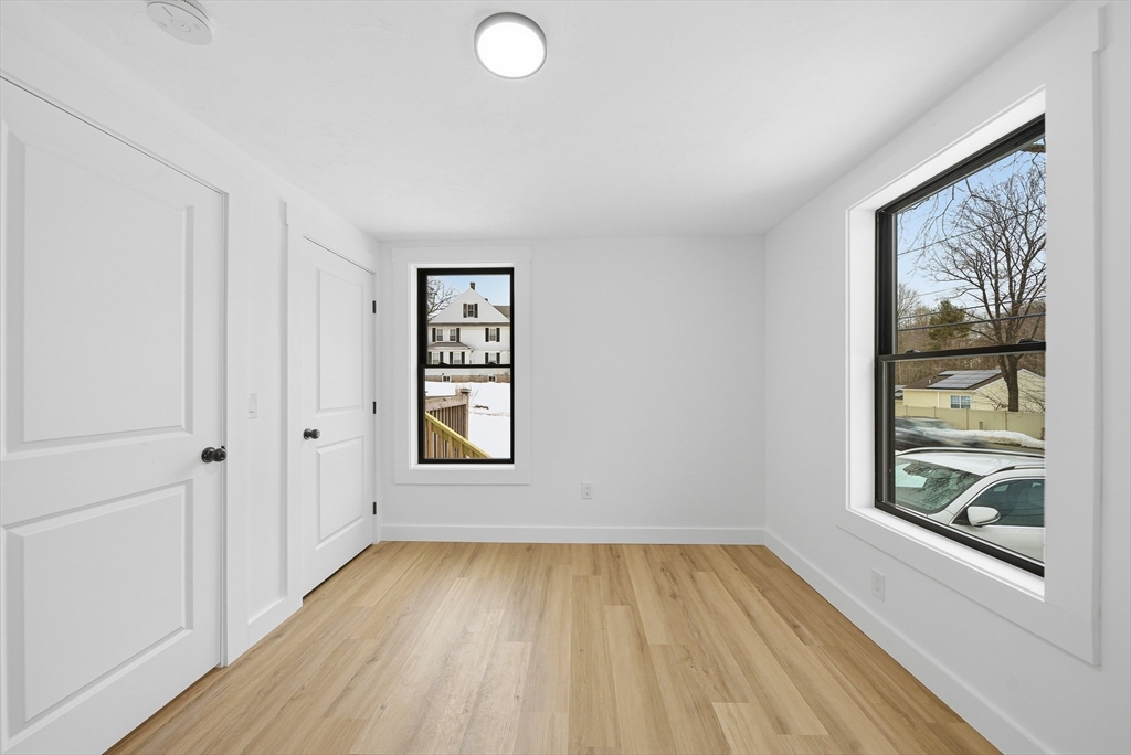 26 Rivulet Street Uxbridge, MA 01569 - Photo 21 of 41 wooden floor in an empty room with a window