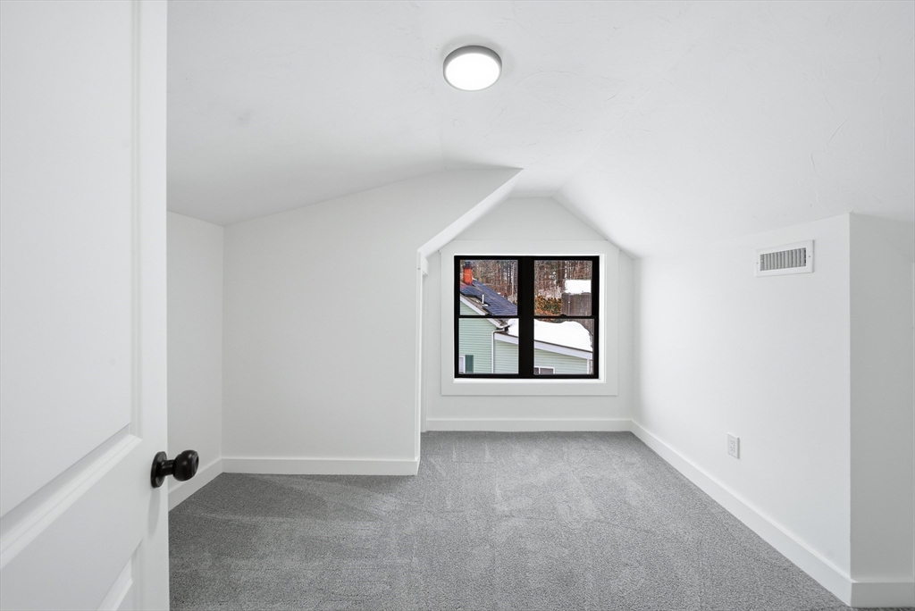 26 Rivulet Street Uxbridge, MA 01569 - Photo 24 of 41 an empty room with windows and entrance