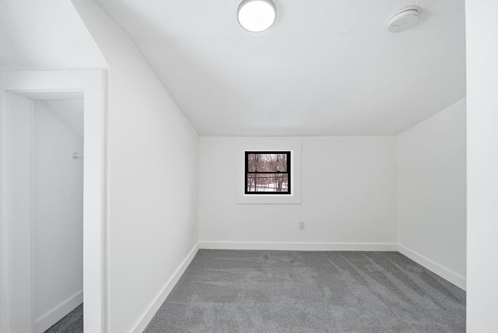 26 Rivulet Street Uxbridge, MA 01569 - Photo 28 of 41 an empty room with a workbench