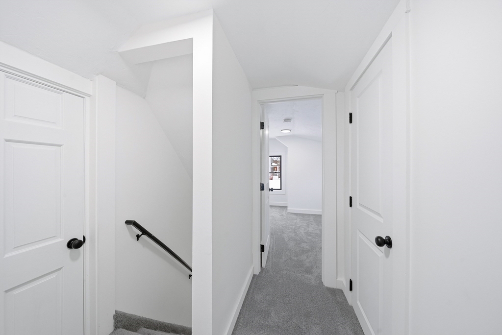 26 Rivulet Street Uxbridge, MA 01569 - Photo 30 of 41 a view of a bathroom from a hallway