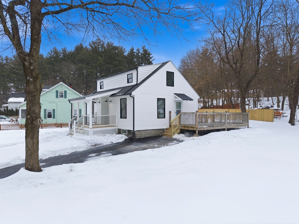 26 Rivulet Street Uxbridge, MA 01569 - Photo 37 of 41 a view of a white house with a snow in the yard
