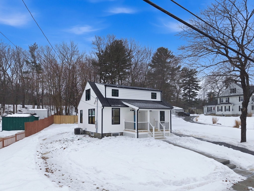 26 Rivulet Street Uxbridge, MA 01569 - Photo 38 of 41 a front view of a house with a yard covered in snow
