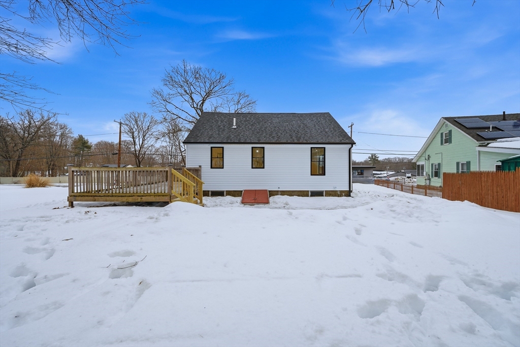 26 Rivulet Street Uxbridge, MA 01569 - Photo 40 of 41 a view of a house with a snow in the yard