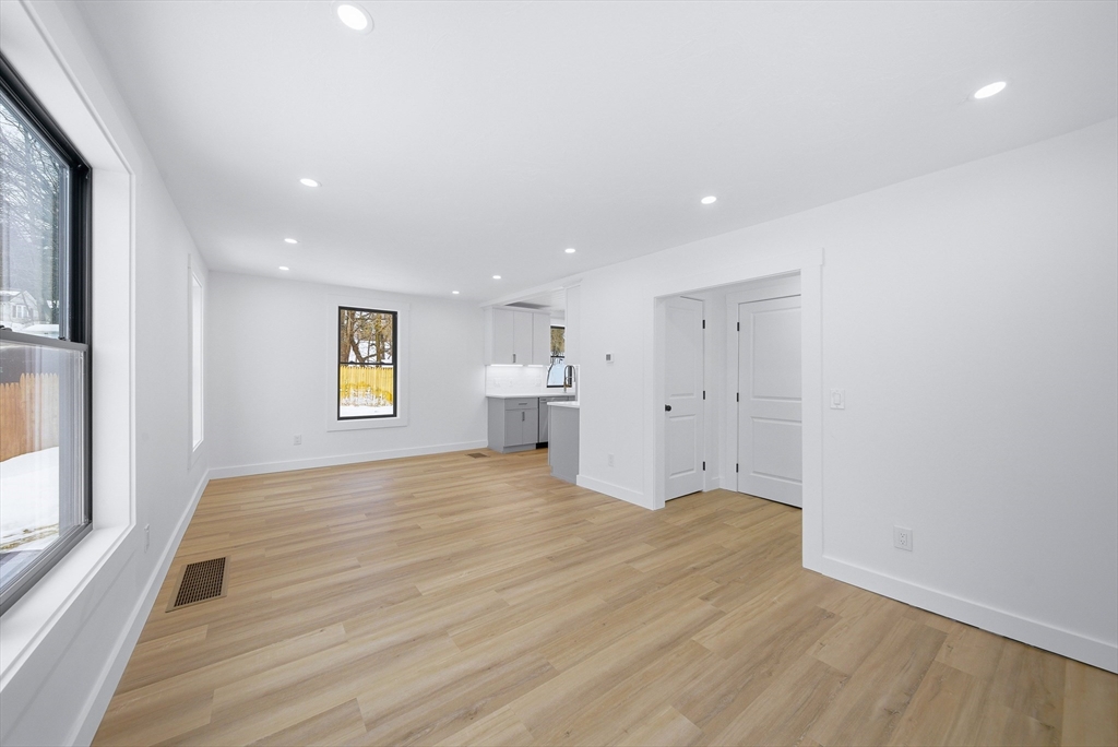 26 Rivulet Street Uxbridge, MA 01569 - Photo 5 of 41 a view of empty room with wooden floor and window