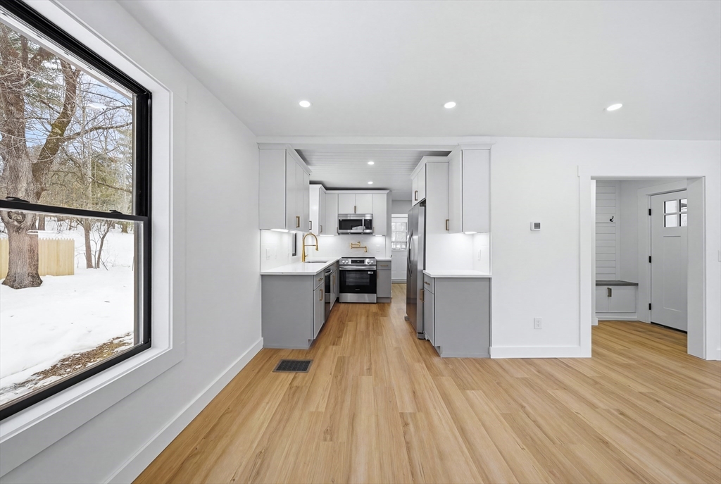 26 Rivulet Street Uxbridge, MA 01569 - Photo 8 of 41 a large kitchen with a lot of counter space and stainless steel appliances