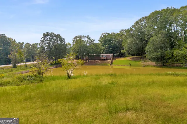 a view of a swimming pool with an outdoor space and seating area