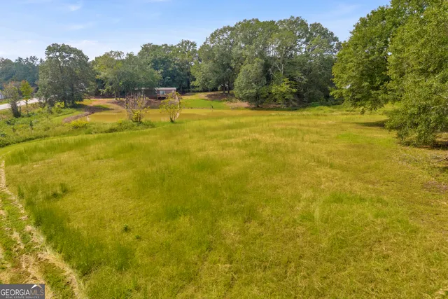 a view of a lake with houses in the back