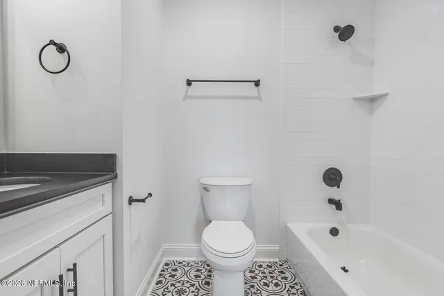 a bathroom with a sink a toilet and a bathtub