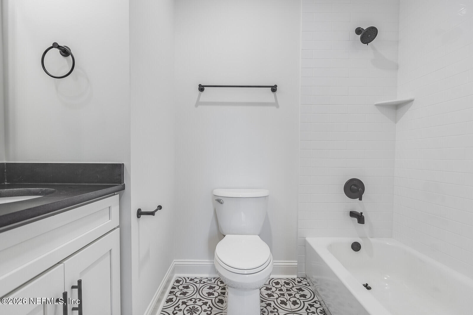 45055 Luther Street Callahan, FL 32011 - Photo 14 of 17 a bathroom with a sink a toilet and a bathtub