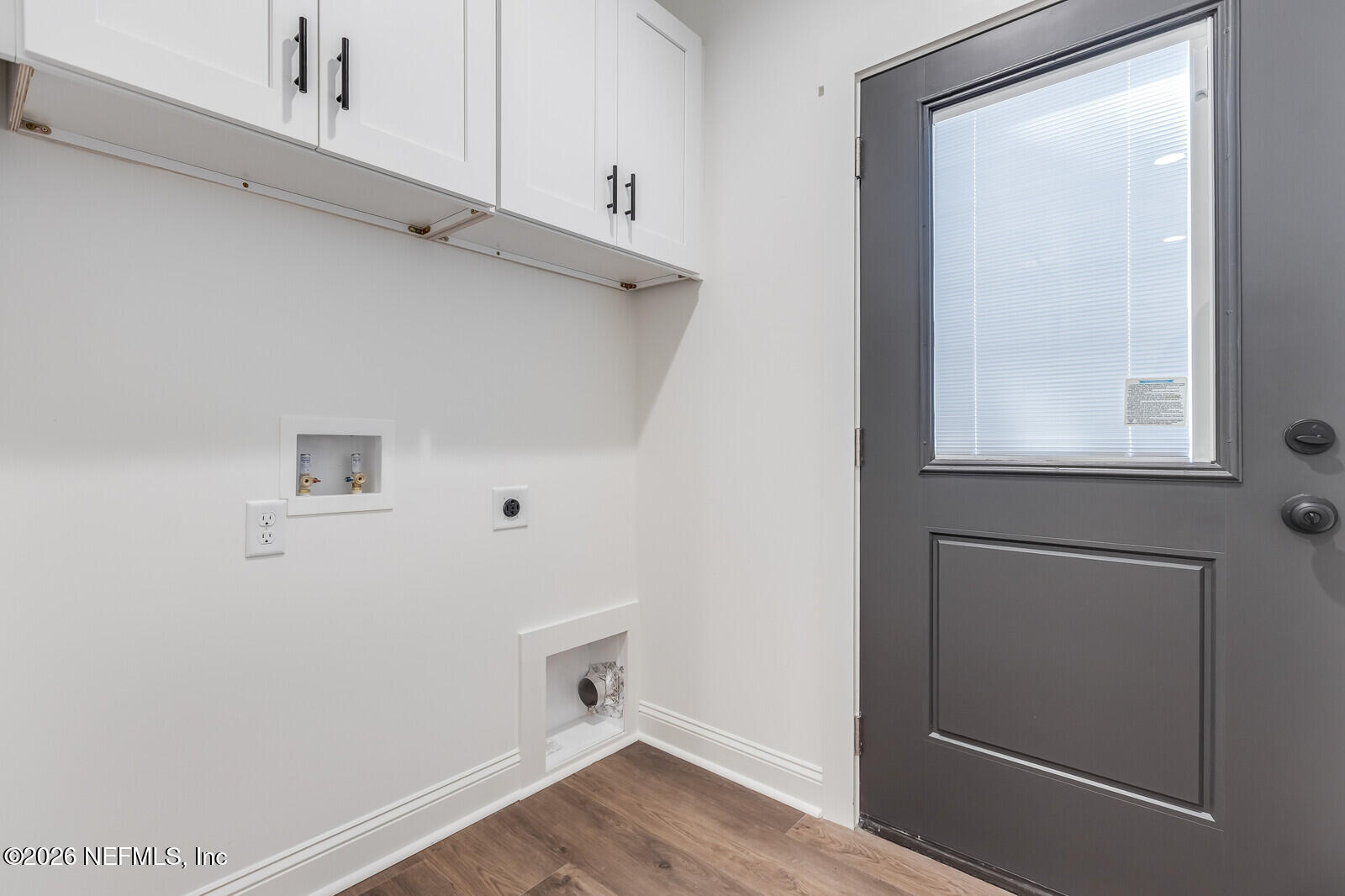 45055 Luther Street Callahan, FL 32011 - Photo 15 of 17 a view of an empty room with wooden floor and a window
