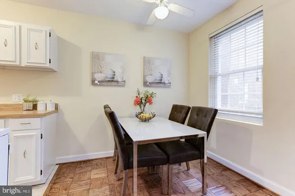 a view of a dining room with furniture and window