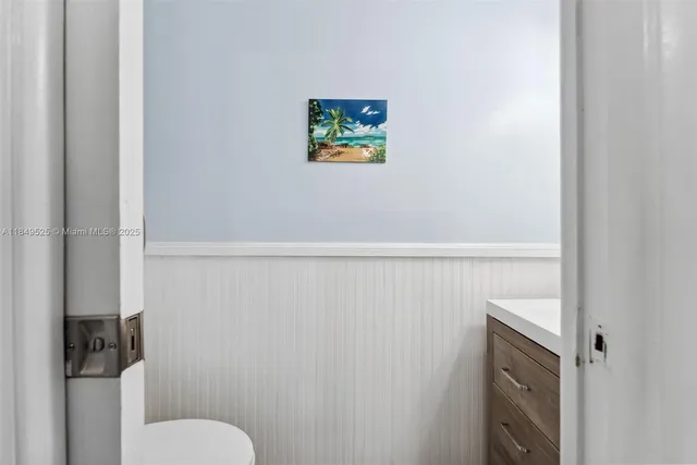 a bedroom with a bed and a ceiling fan