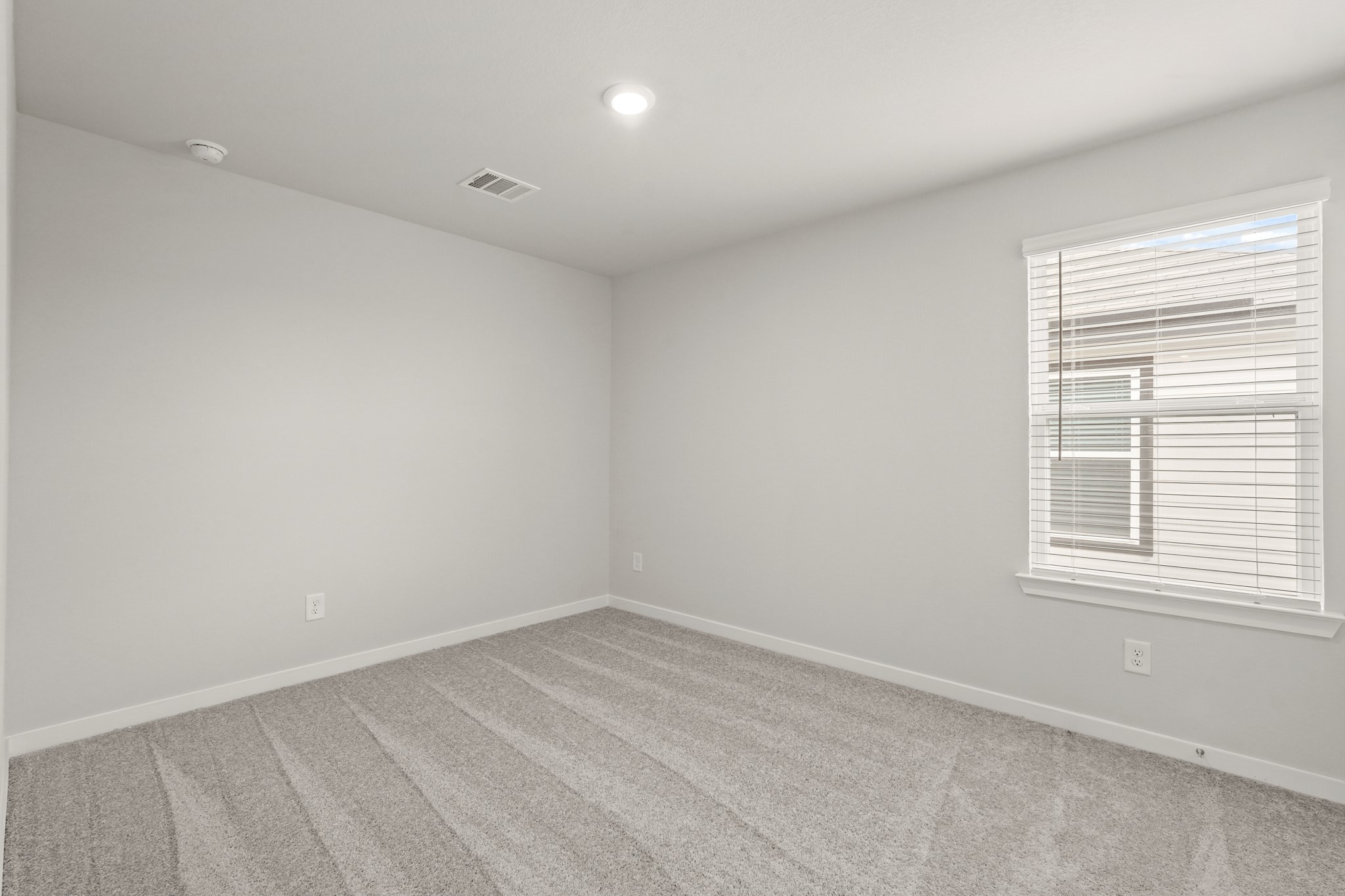 113 Rising Cedar Lane Hockley, TX 77447 - Photo 18 of 27 an empty room with a window