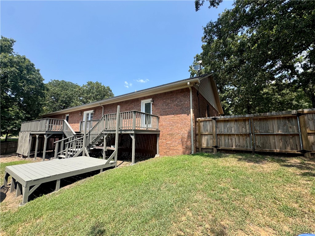1197 Ridgeview Lane Russellville, AR 72802 - Photo 41 of 44 Multi-level wood deck with stairs and an additional ground-level platform