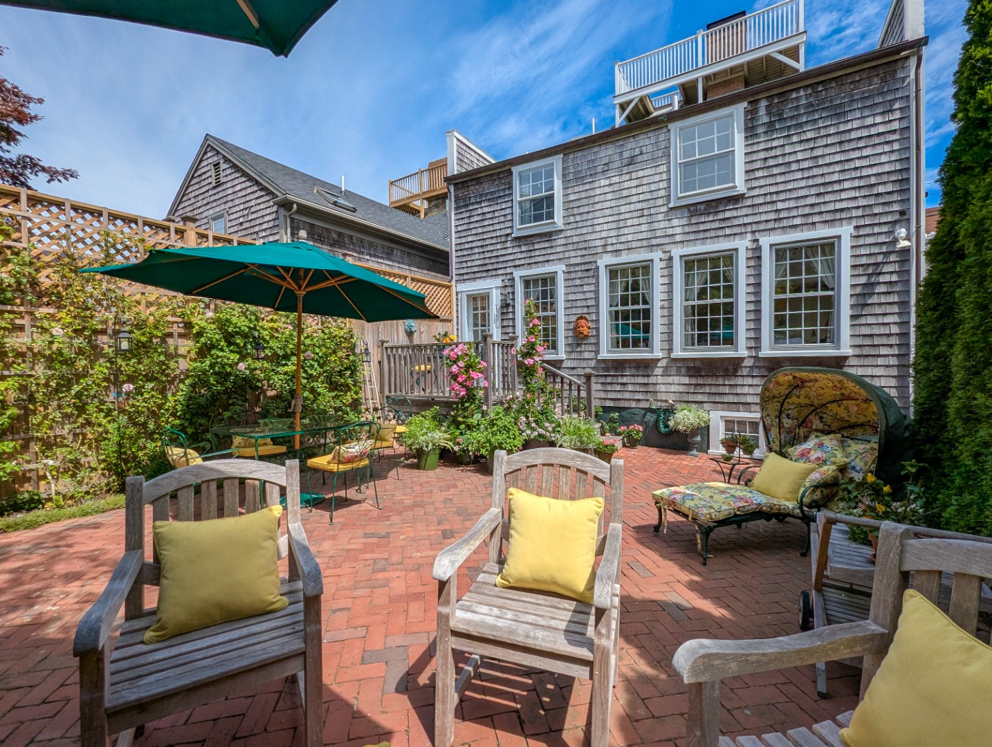 37 Union Street Nantucket, MA 02554 - Photo 7 of 25 a view of a chairs and table in the patio
