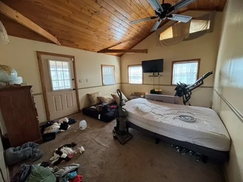 a bedroom with a bed furniture and a window