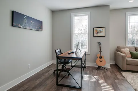 a workspace with furniture and window