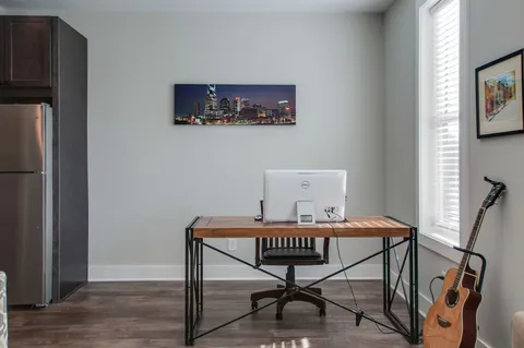 a living room with furniture and a window