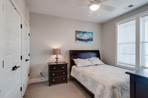 a bathroom with a sink toilet a mirror and shower