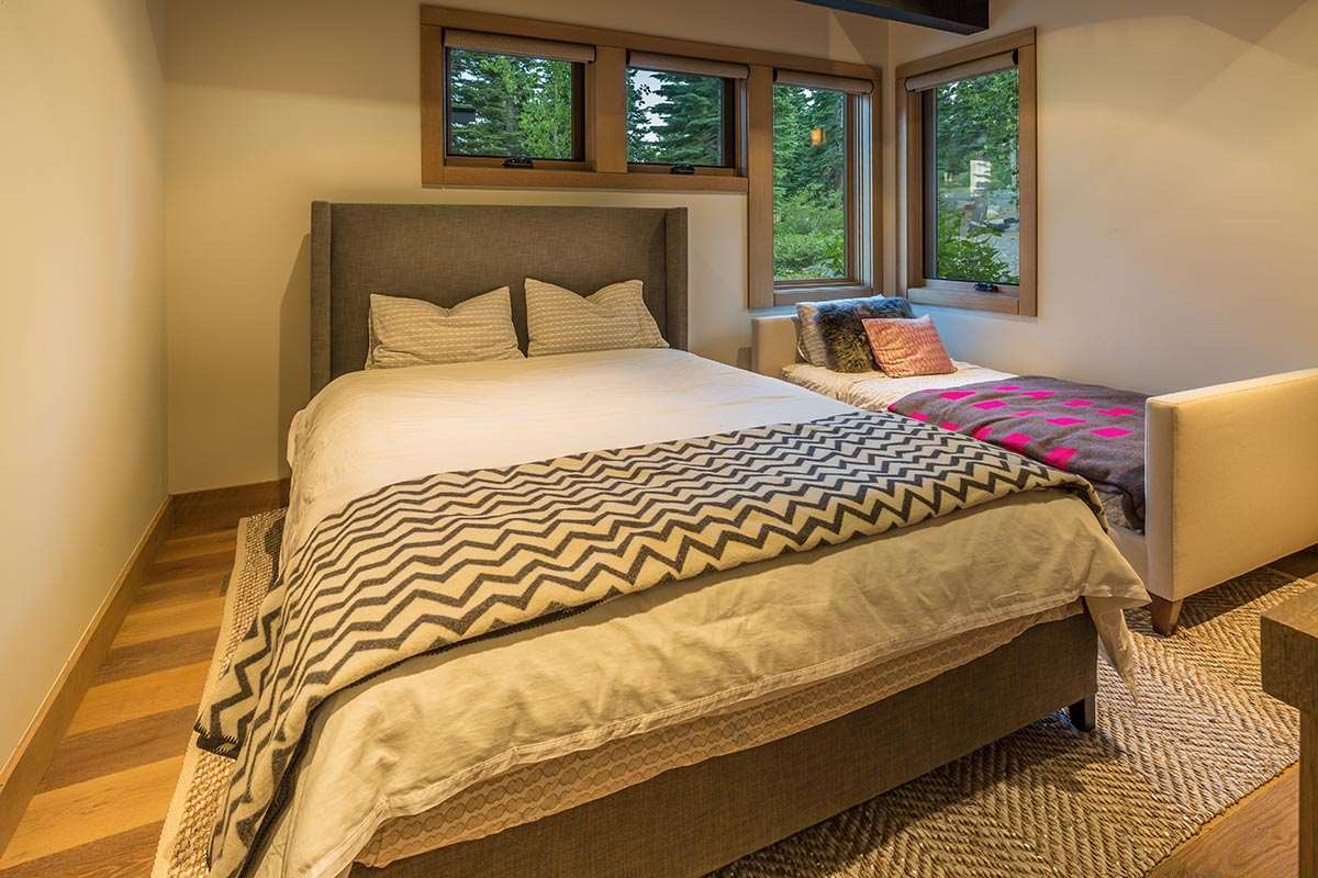 8370 Valhalla Drive Truckee, CA 96161 - Photo 12 of 13 a bed sitting in a bedroom next to a window