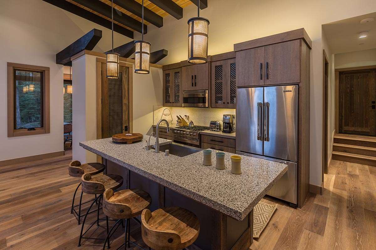 8370 Valhalla Drive Truckee, CA 96161 - Photo 9 of 13 a kitchen with stainless steel appliances granite countertop a sink refrigerator and microwave