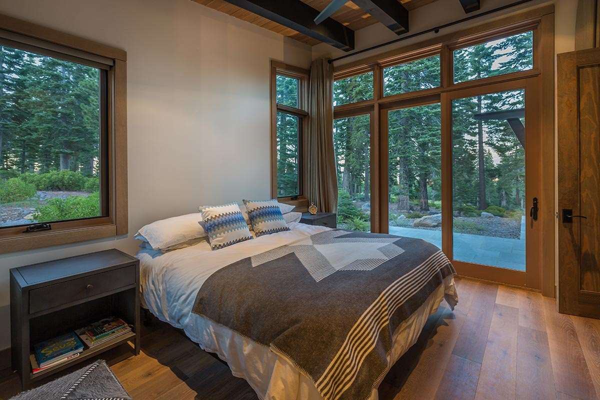 8370 Valhalla Drive Truckee, CA 96161 - Photo 10 of 13 a bed sitting in a bedroom next to a large window