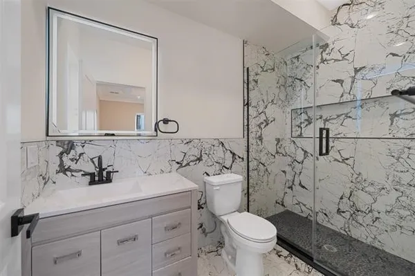 a kitchen with stainless steel appliances a sink stove and cabinets