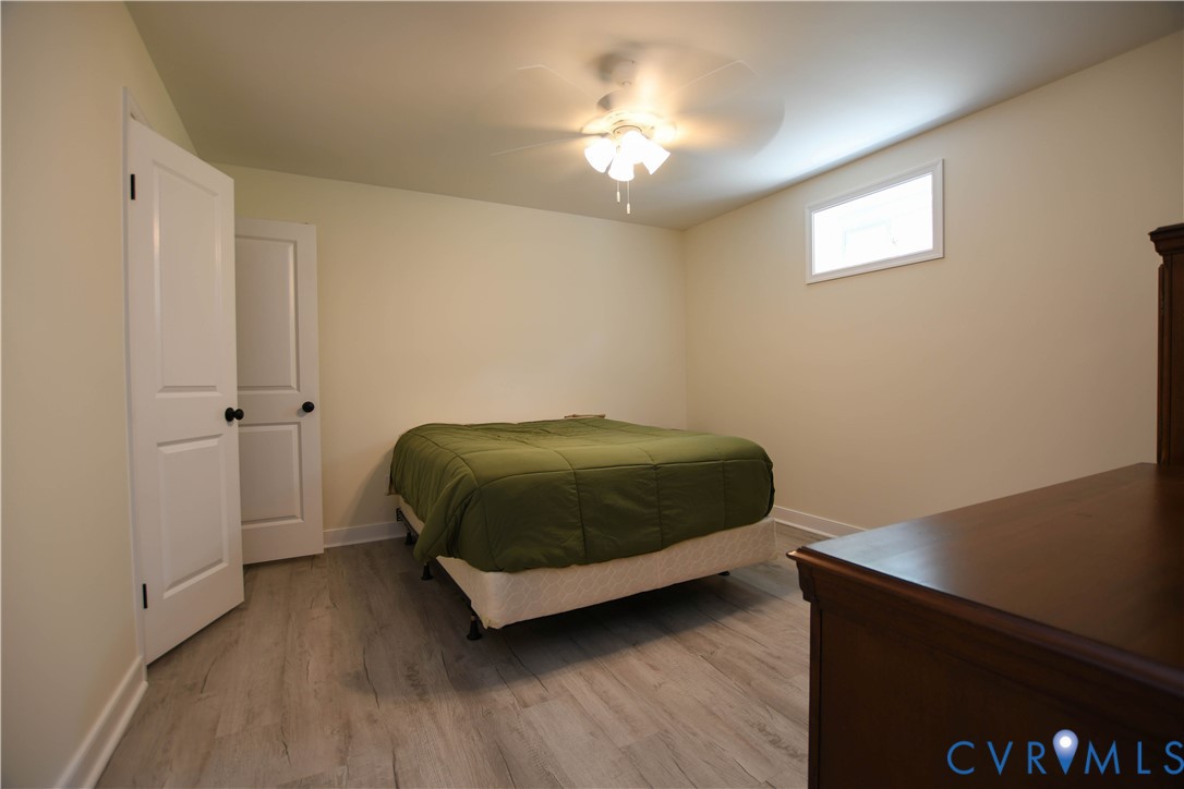 1448 Canterbury Road St. Stephens Church, VA 23148 - Photo 28 of 57 Room with light-toned walls and wood-finish floori