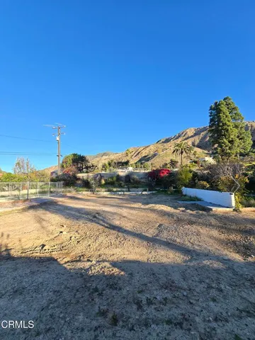 a view of a yard with an ocean