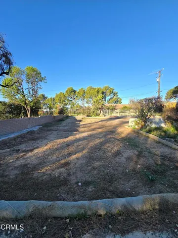 a view of a lake with a house in the background