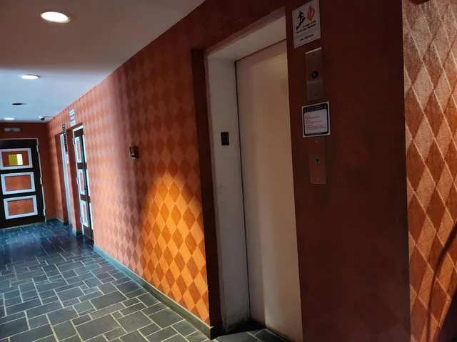 a kitchen with granite countertop a stove top oven microwave and cabinets