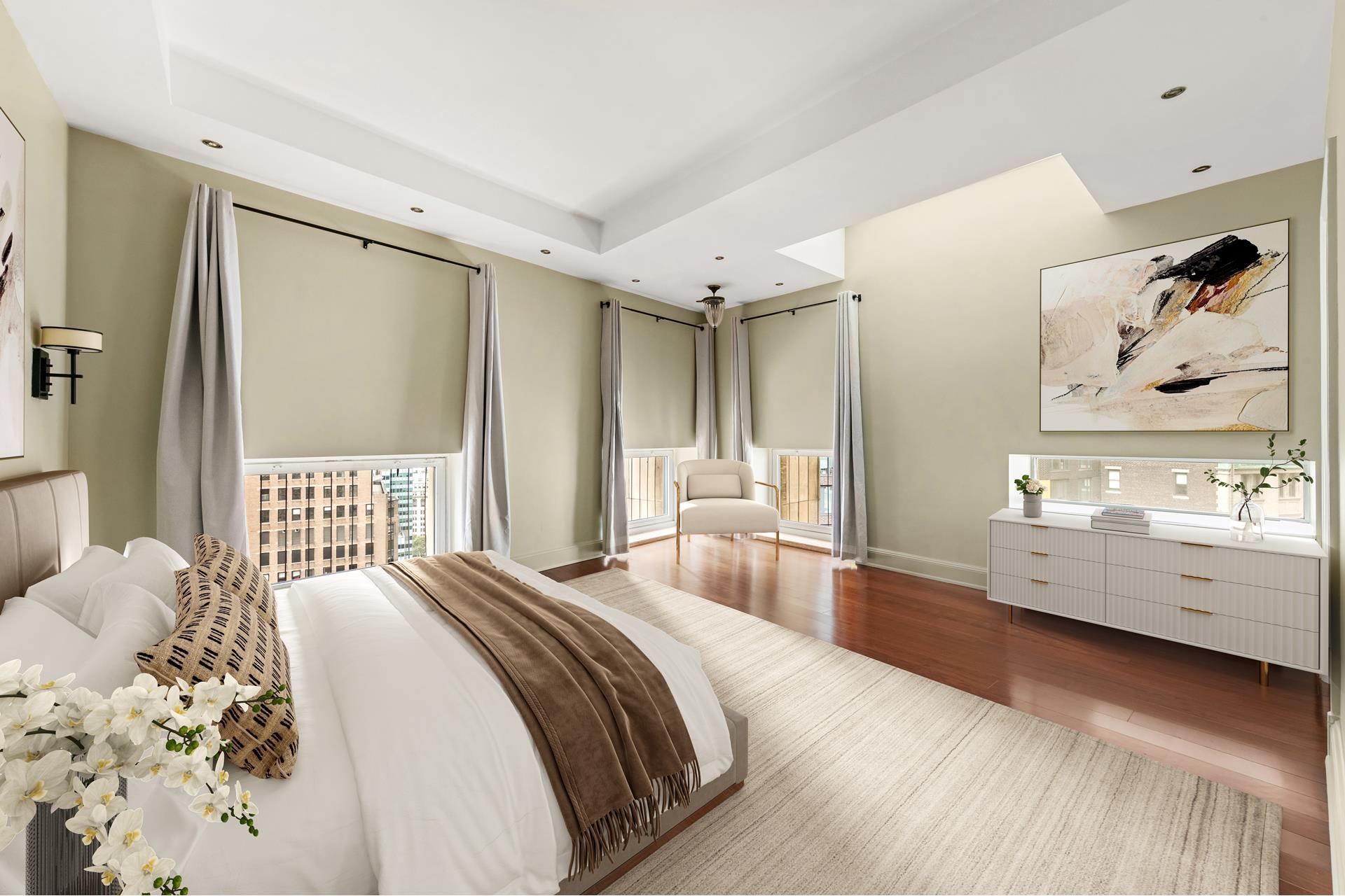 3 Hanover Square, Unit 22A Manhattan, NY 10004 - Photo 7 of 23 a spacious bedroom with a large bed and a dresser