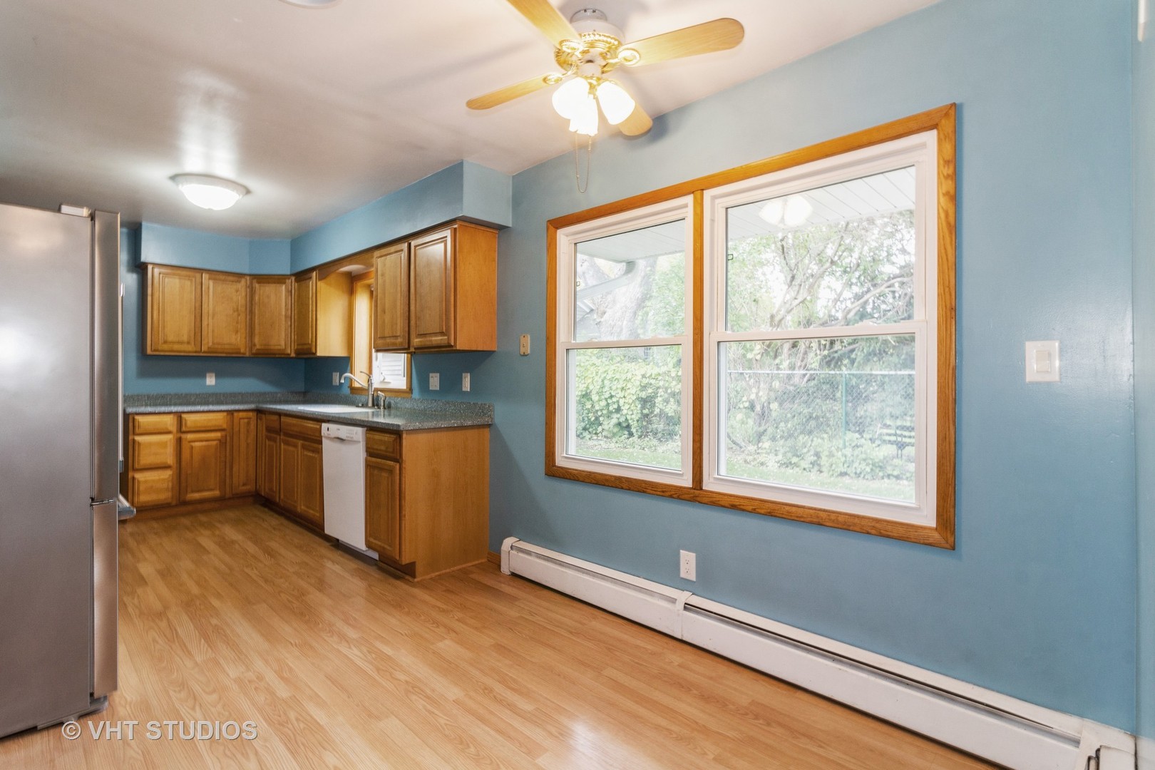 211 East Ottawa Street Sycamore, IL 60178 - Photo 12 of 33 a kitchen with granite countertop a stove a sink a window and stainless steel appliances