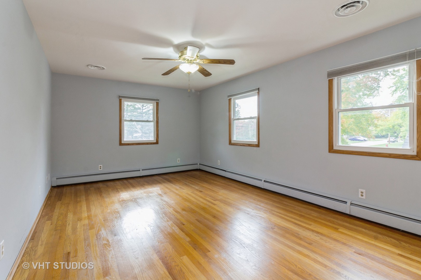 211 East Ottawa Street Sycamore, IL 60178 - Photo 16 of 33 a view of an empty room with wooden floor and a window