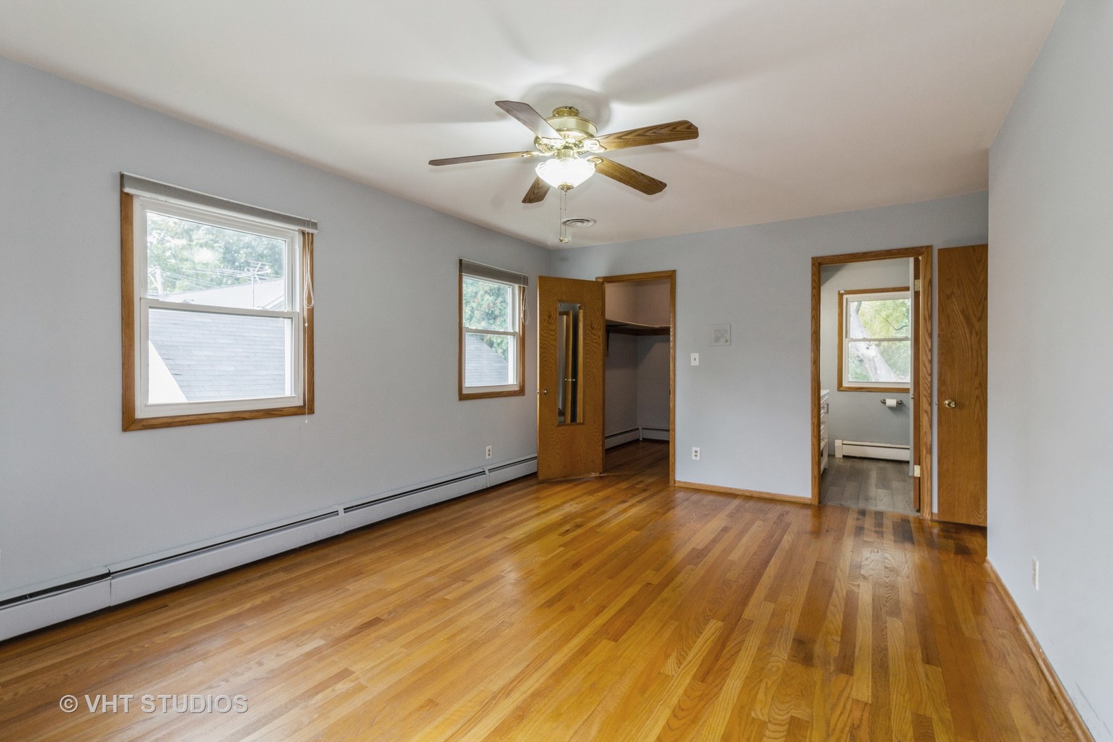 211 East Ottawa Street Sycamore, IL 60178 - Photo 17 of 33 a view of an empty room with wooden floor and a window