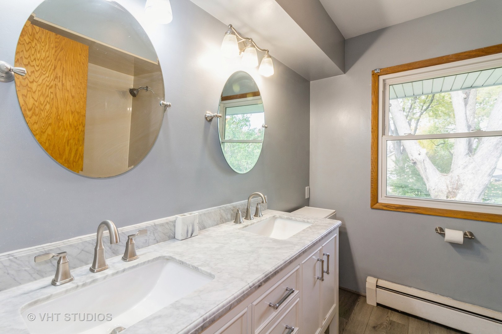 211 East Ottawa Street Sycamore, IL 60178 - Photo 18 of 33 a bathroom with a granite countertop double vanity and a mirror