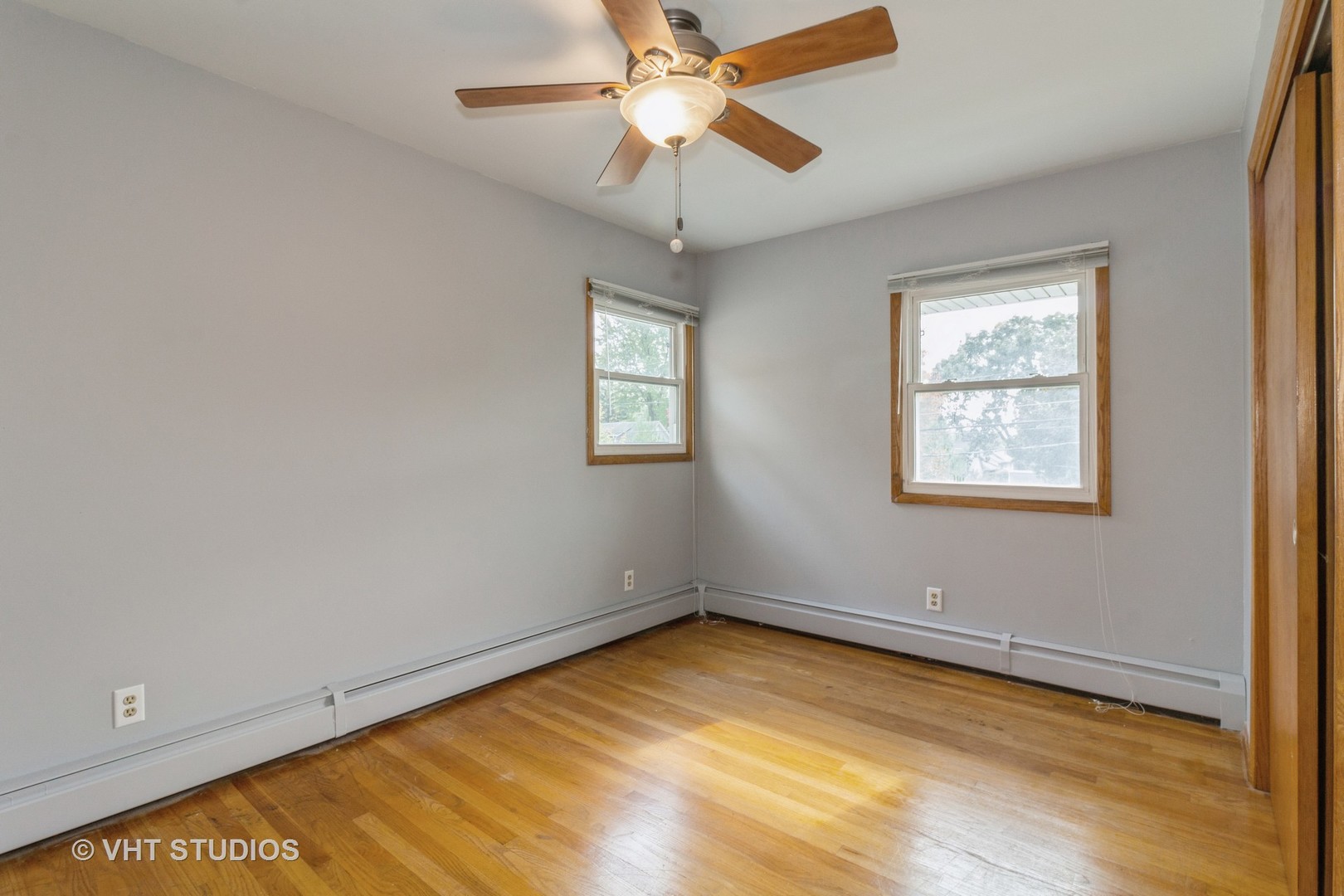 211 East Ottawa Street Sycamore, IL 60178 - Photo 21 of 33 an empty room with a window and a ceiling fan