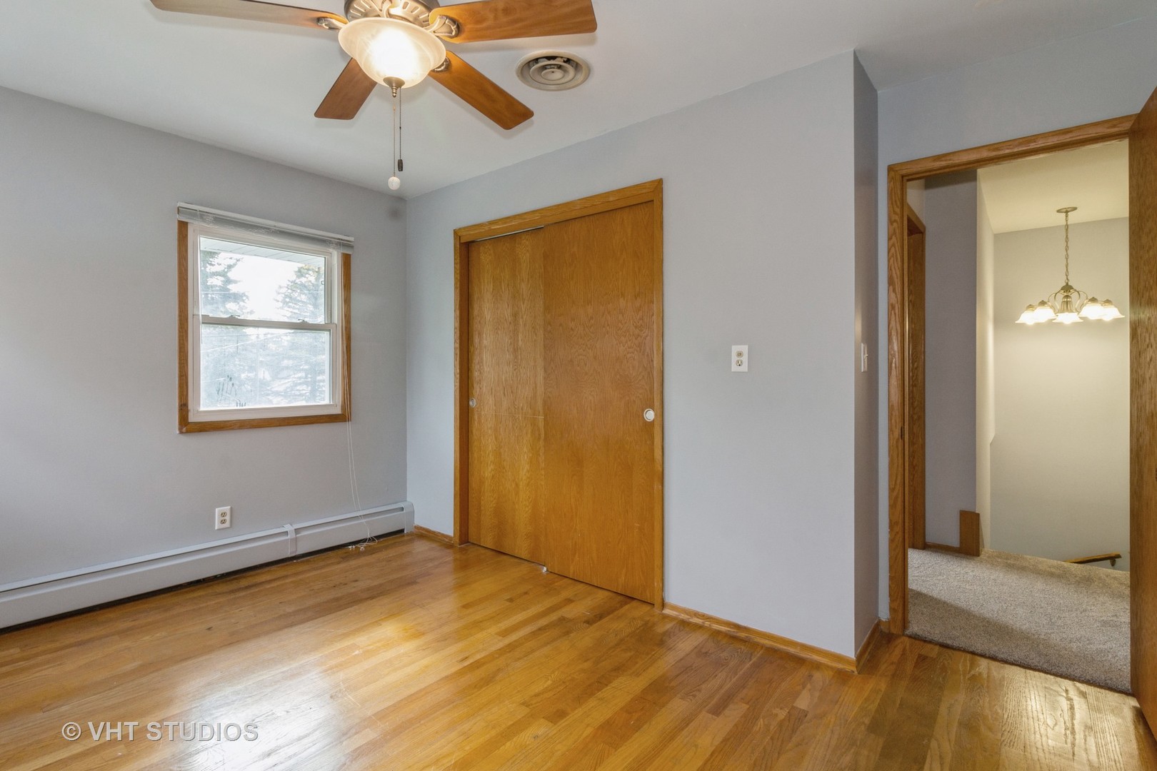 211 East Ottawa Street Sycamore, IL 60178 - Photo 22 of 33 a view of livingroom with hardwood floor and ceiling fan