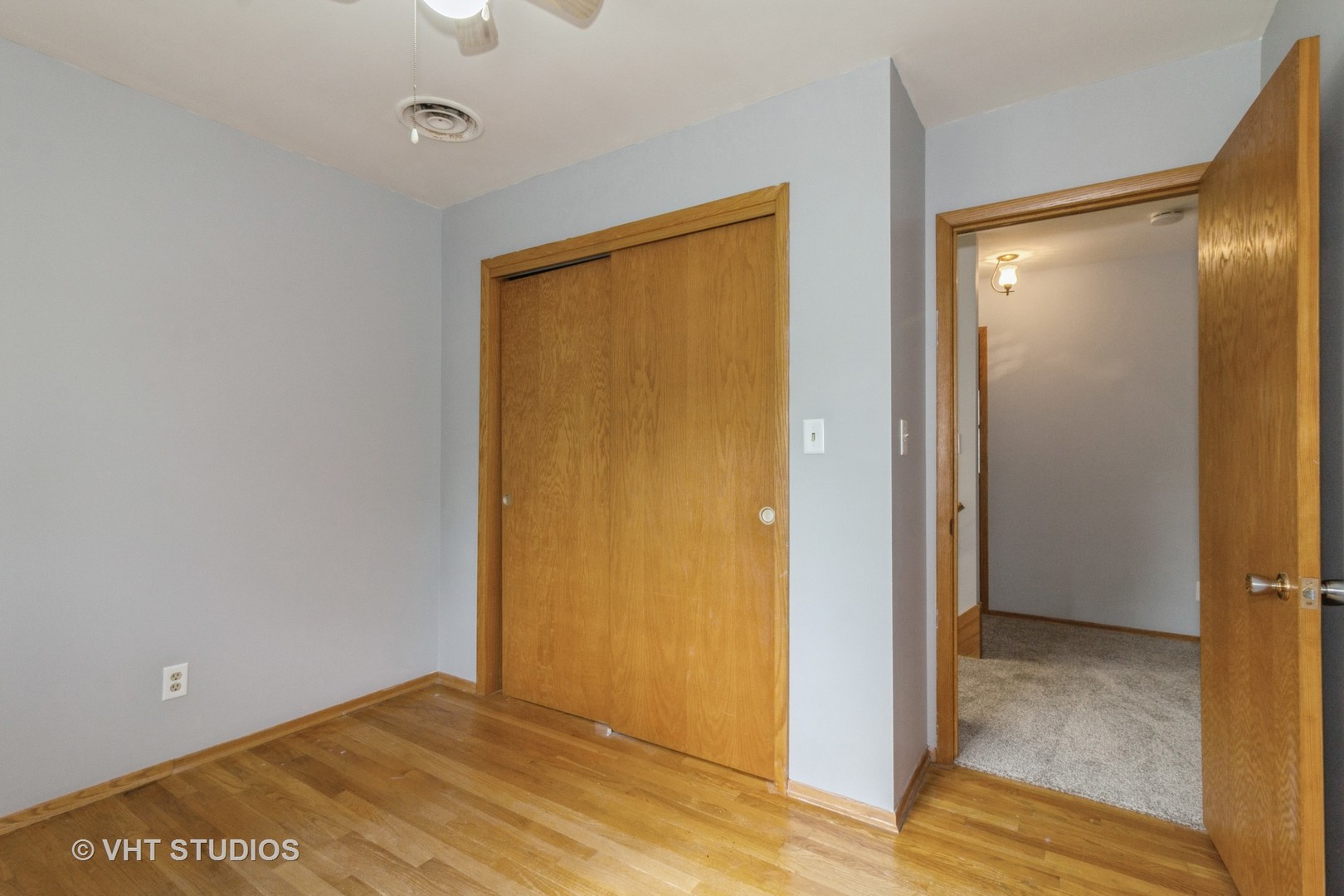 211 East Ottawa Street Sycamore, IL 60178 - Photo 24 of 33 a view of an empty room with wooden floor and a bathroom