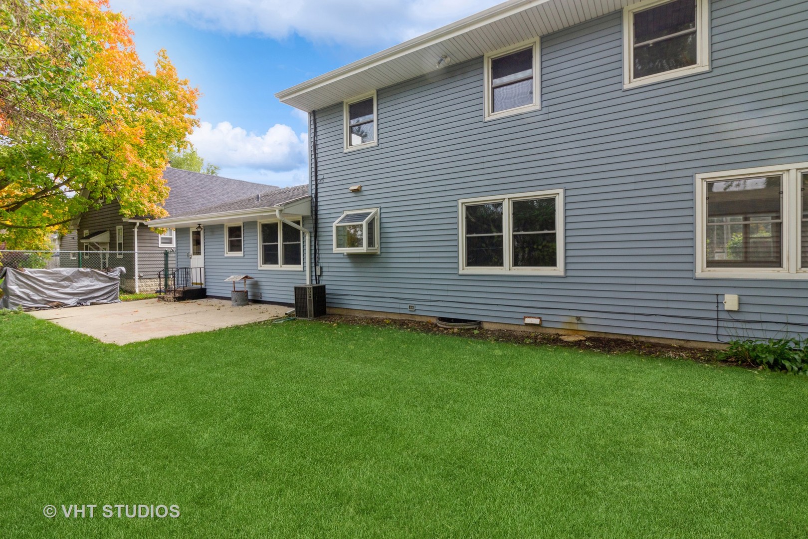 211 East Ottawa Street Sycamore, IL 60178 - Photo 33 of 33 a backyard of a house with table and chairs