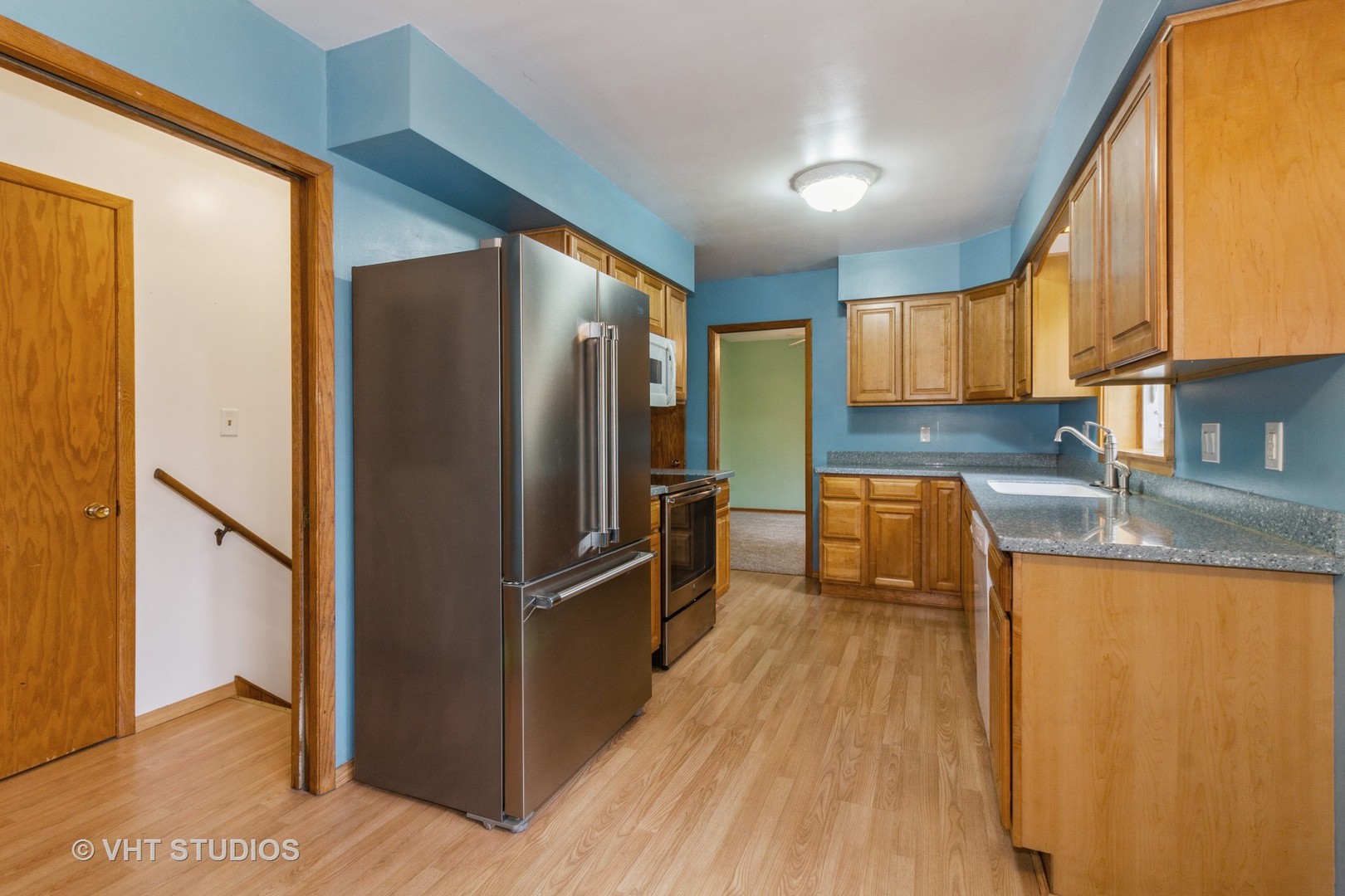 211 East Ottawa Street Sycamore, IL 60178 - Photo 9 of 33 a kitchen with granite countertop a refrigerator and a sink