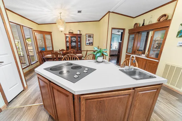 a dining room with furniture and wooden floor