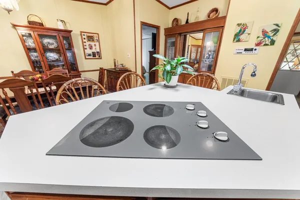 a dining room with furniture window and wooden floor