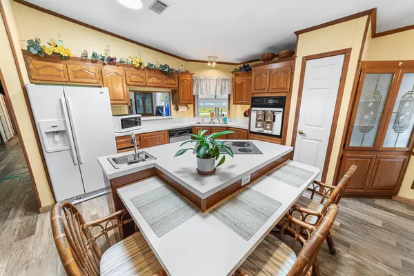a living room with fireplace furniture and a window